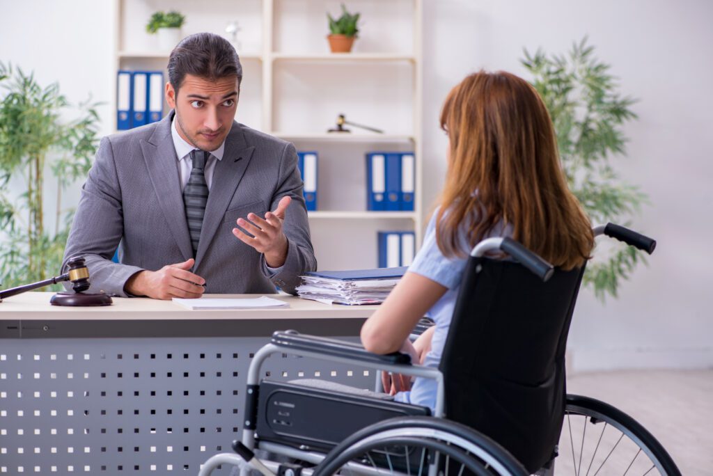 Young Injured Woman and Male Lawyer in the Courtroom.